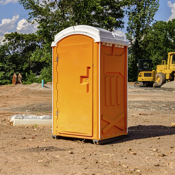 what is the cost difference between standard and deluxe porta potty rentals in Hasty